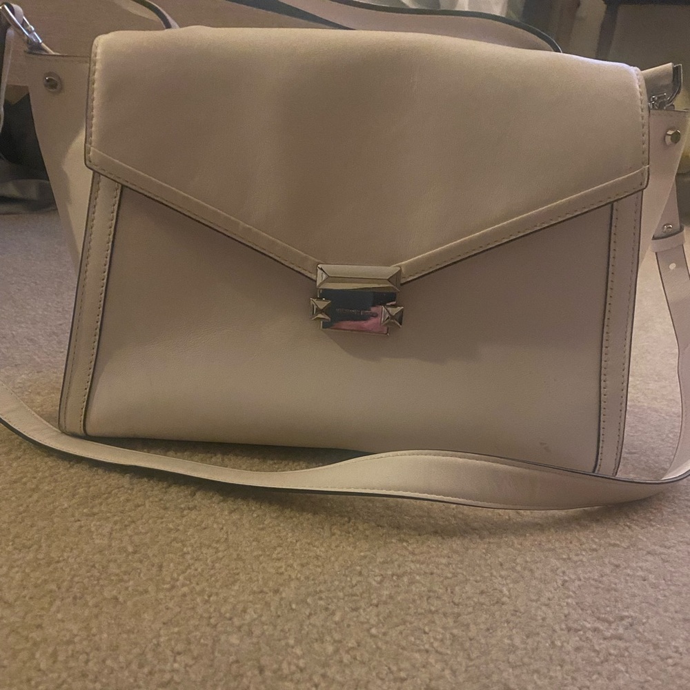 Michael Kors white purse over the shoulder